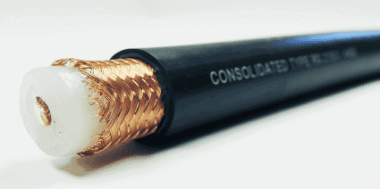 Close-up view of a stripped coaxial cable revealing its shielding layers.